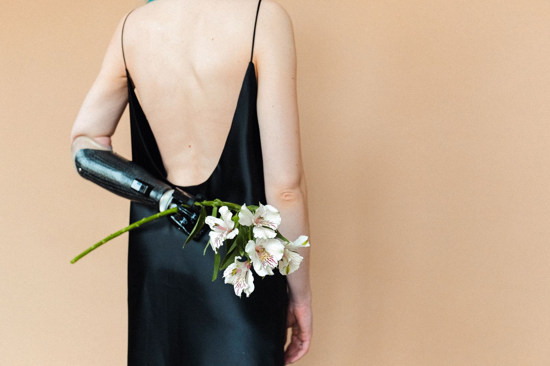 Simple black satin slip dress with art deco jewellery
