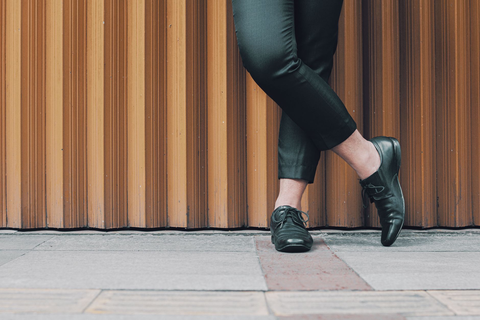 Business casual outfit with black dress pants, blue shirt and brown loafers