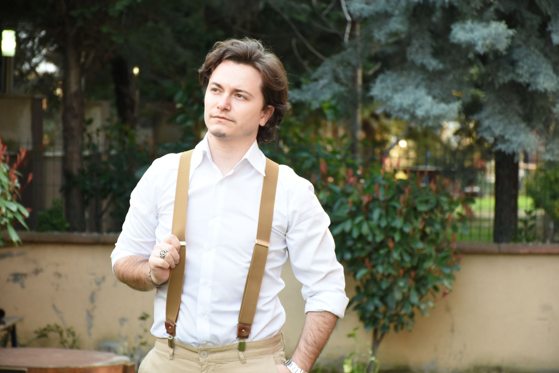 Pinstripe trousers, white spread collar shirt and bold striped suspenders