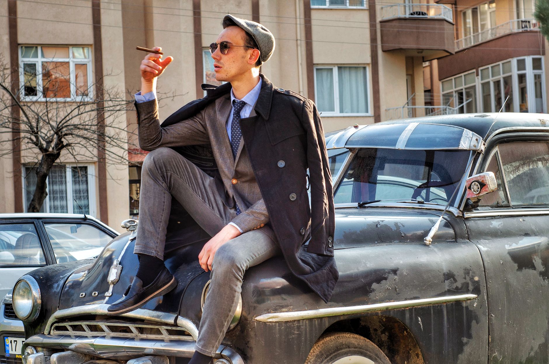 1940s vintage mens style outfit with high-waisted wool trousers and braces
