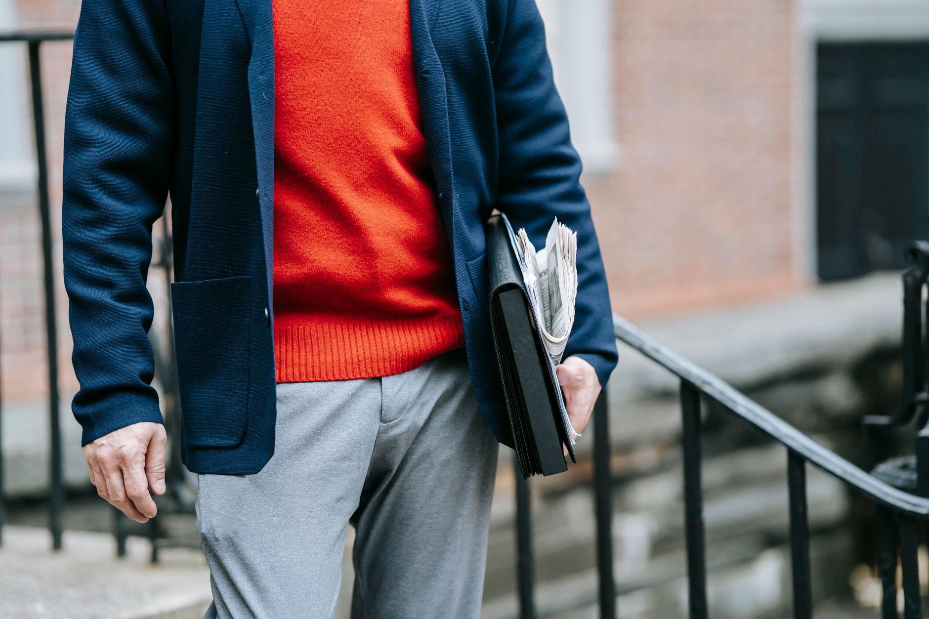 Navy blazer with grey trousers next to a matching grey suit