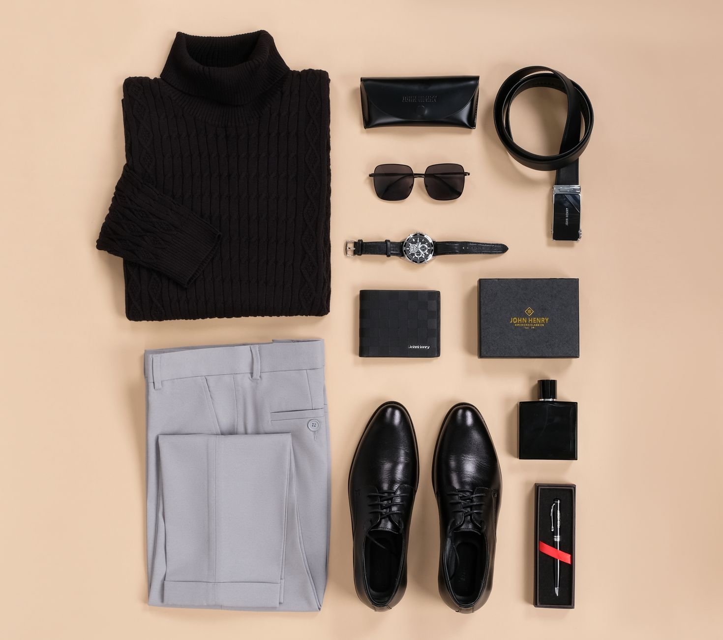 Flat lay of business casual essentials including a light blue oxford shirt, navy chinos and brown leather loafers