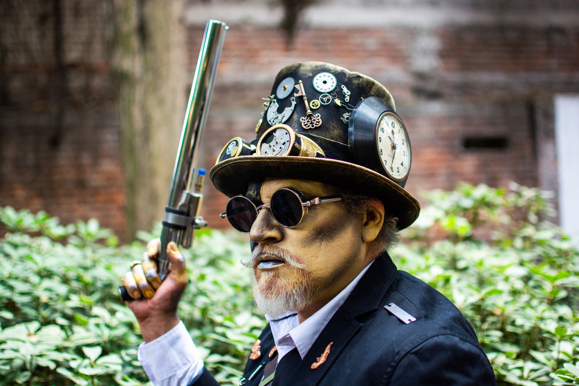 Steampunk airship captain in a navy frock coat with epaulettes and brass buttons