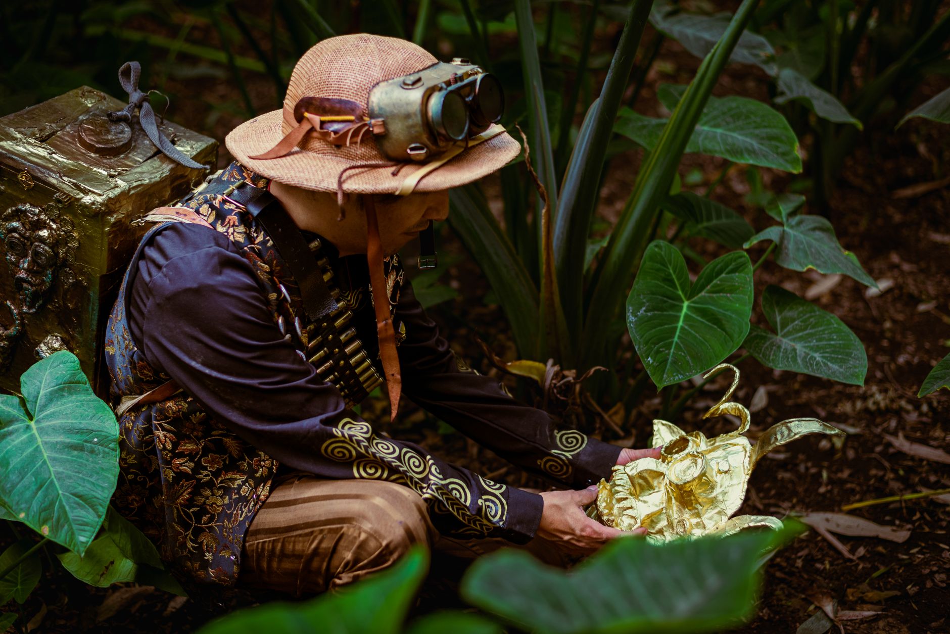 Steampunk explorer costume with pith helmet, khaki jacket and brass spyglass