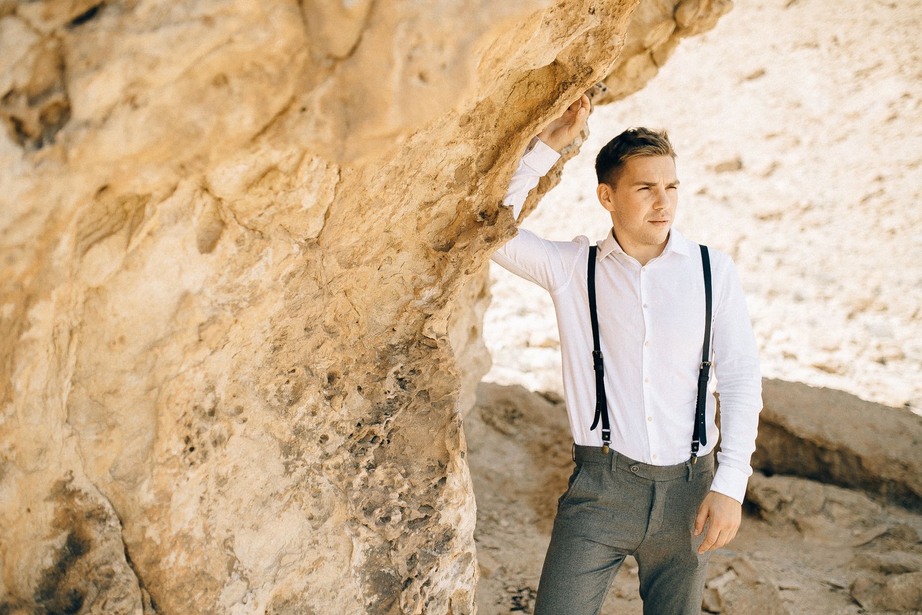 Chambray shirt and stone chinos worn with slim navy suspenders