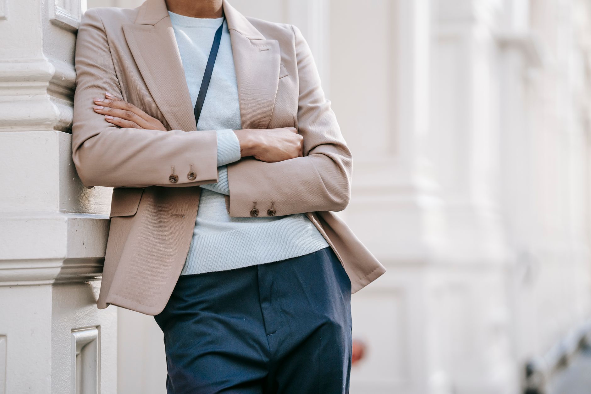 Unstructured navy blazer with a pale blue linen shirt and tan trousers