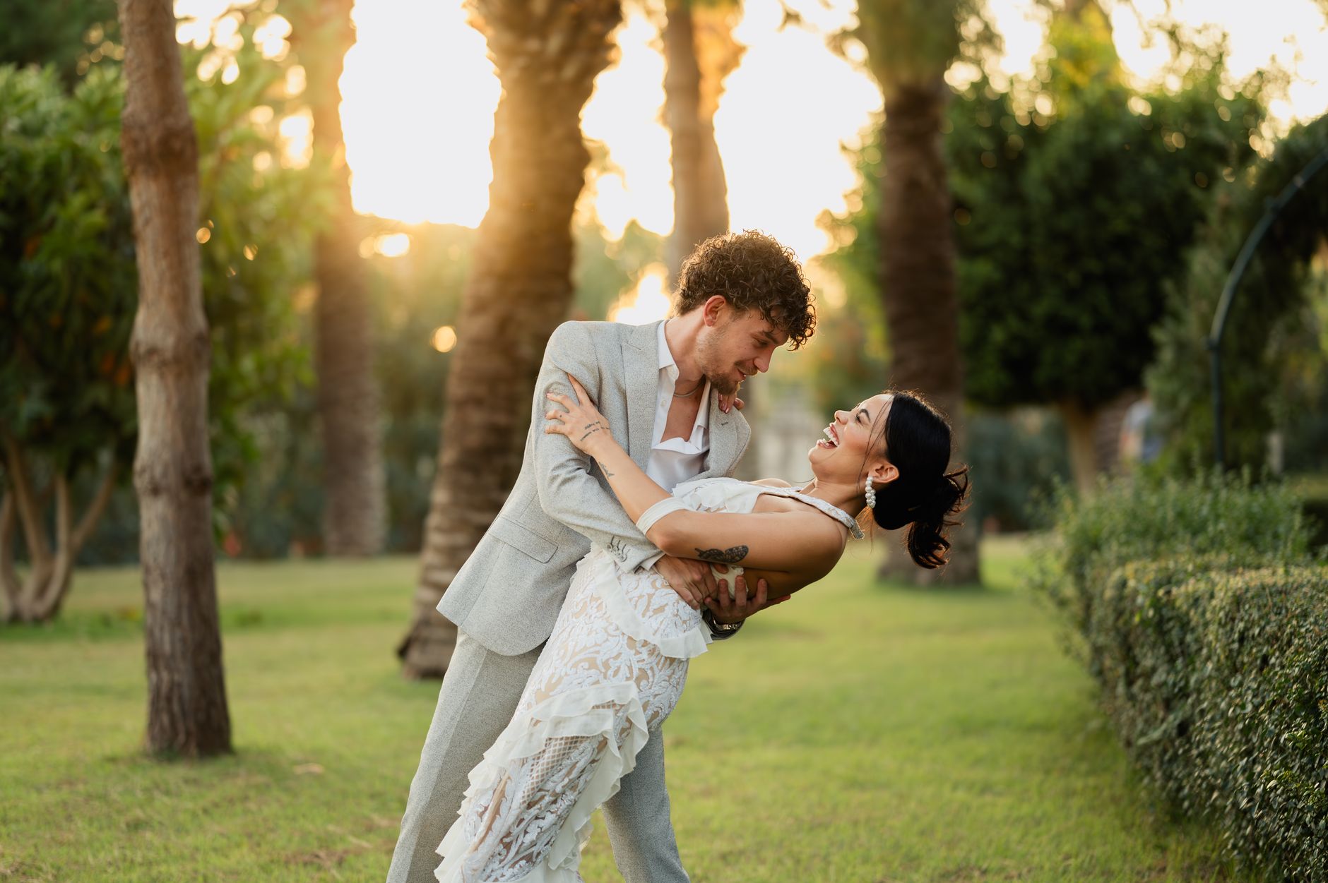 Light linen suit for a summer wedding photographed outdoors in daylight
