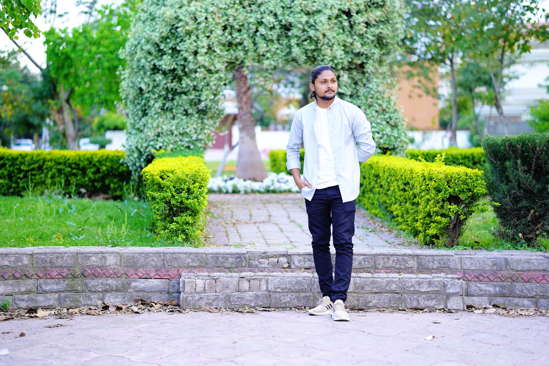 Black chinos worn with a white dress shirt and black leather shoes