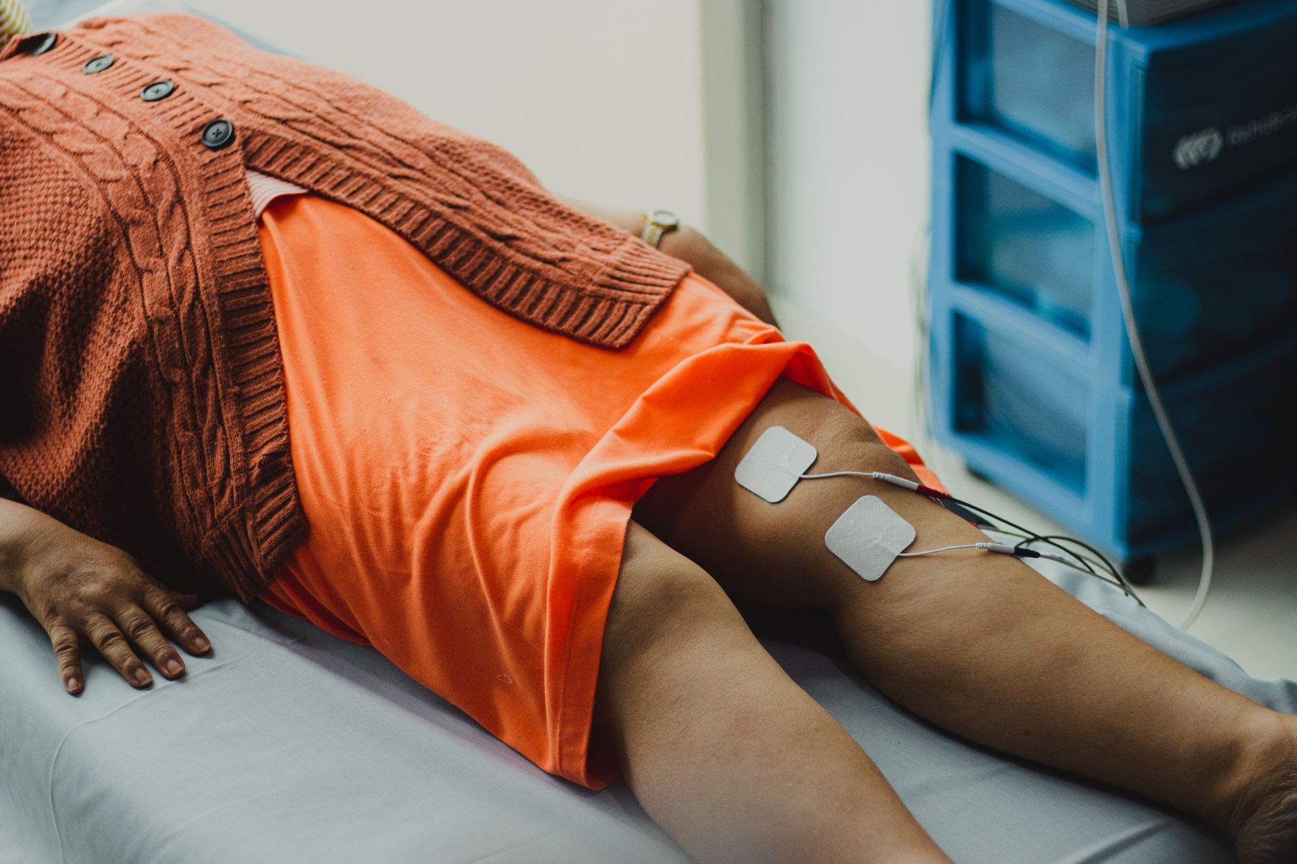 Multiple muscle stimulation applicator pads placed on the abdomen and flanks
