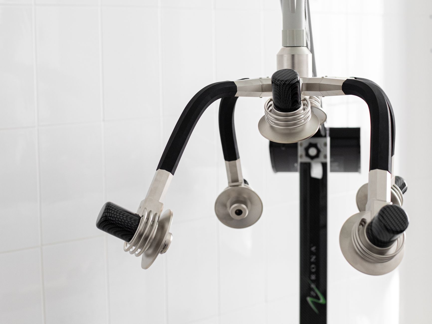 EMS and RF contouring applicators connected to a body sculpting system